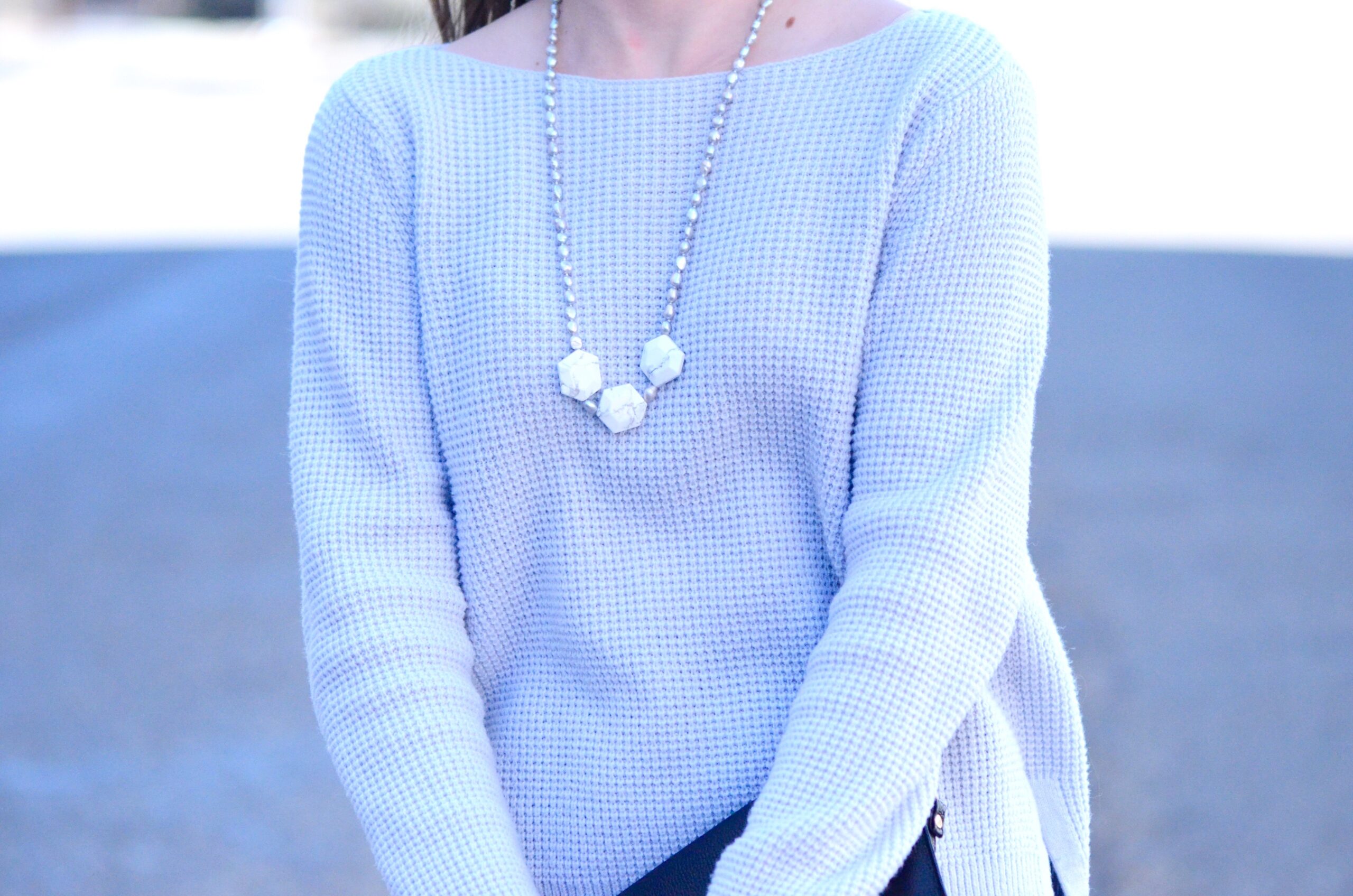blue sweater with marble necklace