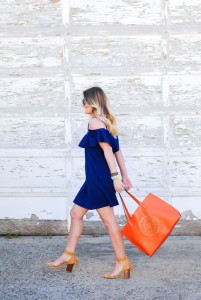 asos ruffled dress and bright orange bag