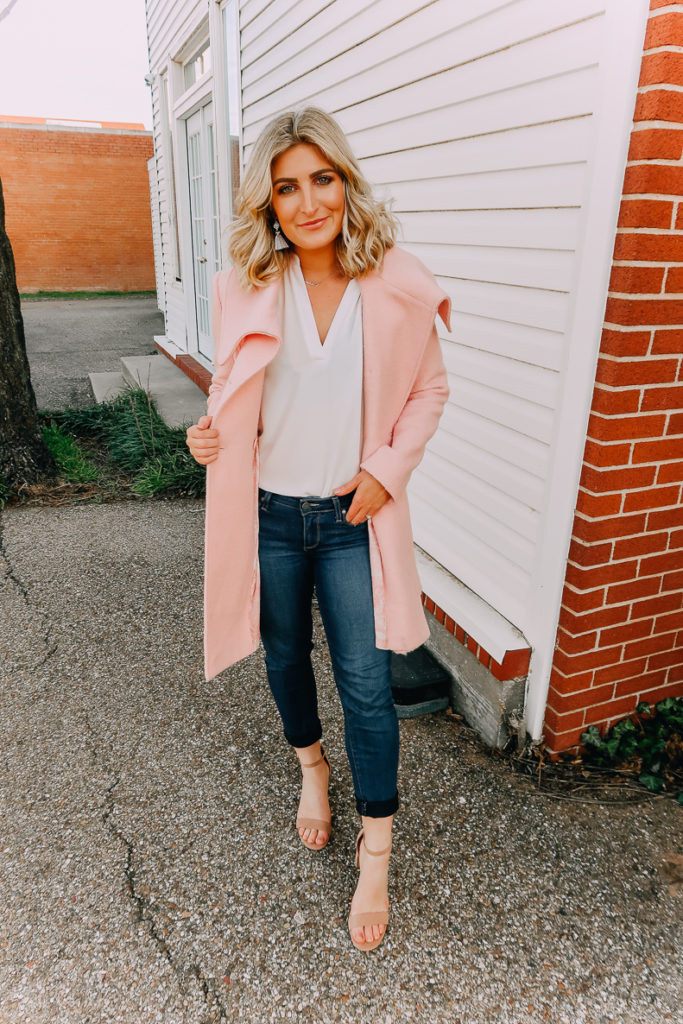 Ways To Wear a White Blouse featured by top US fashion blogger Audrey Madison Stowe; Image of woman wearing white blouse, pink coat and nude heels.