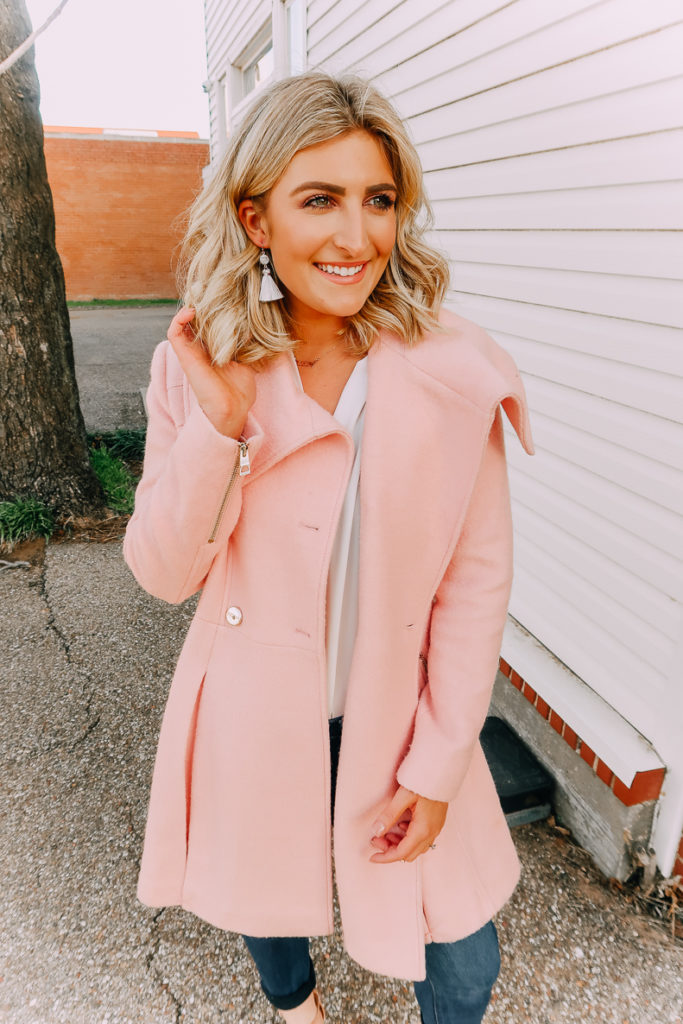 Ways To Wear a White Blouse featured by top US fashion blogger Audrey Madison Stowe; Image of woman wearing white blouse, pink coat and nude heels.