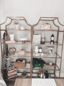 Gold Bookcases Decorated for Fall | Audrey Madison Stowe a fashion and lifestyle blogger